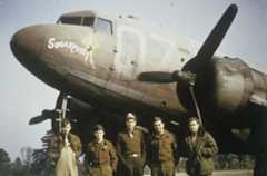 Lieutenant Gilbert Estelle (centre), a pilot of the 438th Troop Carrier Group with his crew and their C-47 Skytrain nicknamed "Sugar Puss" at Greenham Common. Image via Gilbert Estelle. Written on slide casing: '438 TCG.'