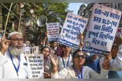 Members of the Booth Level Officers (BLO) stage a protest near the Chief Electoral Officer's office, demanding relief from excessive workload under the 'SIR' system, in Kolkata, in West Bengal, Monday, Nov. 17, 2025.