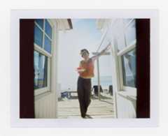 Image may contain Human Person Flooring Clothing Apparel Door Standing and Sleeve