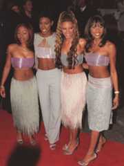 Image may contain LeToya Luckett LaTavia Roberson Kelly Rowland Clothing Footwear High Heel Shoe Fashion and Adult