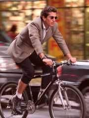Image may contain John F. Kennedy Jr. Wristwatch Clothing Footwear Shoe Adult Person Bicycle Cycling and Sport