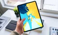 Person Holding Tablet