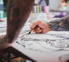 Tattoo Artist Making a Sketch