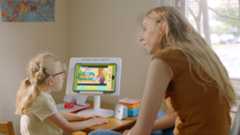 A mom and her deaf daughter play a game with Work It Out Wombats