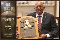 Tony Oliva holding Hall of Fame plaque