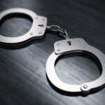 A suspect has been identified in the death of a Fall River man who was shot outside a liquor store Saturday.