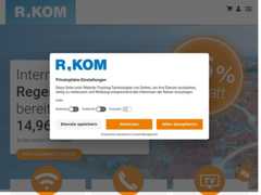 The website screenshot for https://www.r-kom.de
