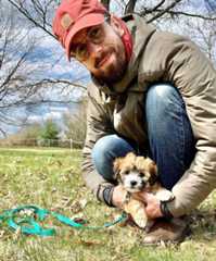 A photo of David Revzin and his dog, June