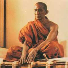 a man sitting on a bed