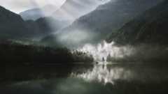 a lake surrounded by mountains
