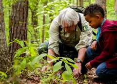 Dennis Krusac teaching a young neighbor about plants