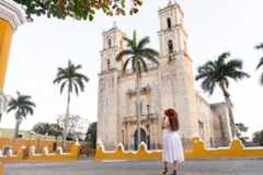 Woman contemplating the cathedral of Valladolid  