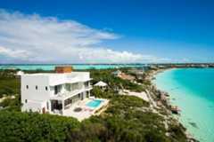 Beachfront modern house with tropical surroundings