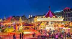 Zurich Fair with carousel and lights at night.