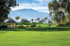 Putting green, golf cart, mountains