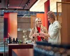 Ladies shopping looking at fragrances