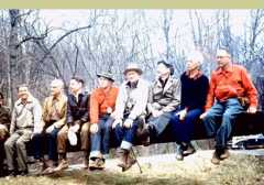 Hikers sitting on lock gate