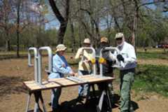 Volunteers assemble picnic table