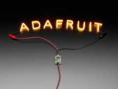 Demo Shot of the Constant Current Boost Converter powering LED Letter Filaments that spell out "Adafruit".