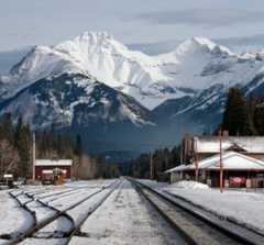 Train tracks and a train station in the Rocky Mountains near Banff