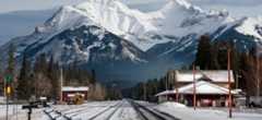 Train tracks and a train station in the Rocky Mountains near Banff