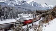 A train passing through the mountains between Calgary and Banff