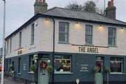 UK pub forced to close for fourth time in 3 years - ‘it’s been a tough year’ A pub on the street corner with sign 'The Angel'