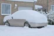 Car covered in heavy snow