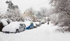 Snow covered residential street in Godalming, Surrey, England, UK