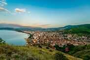 Pogradec stretches along Lake Ohridâs shoreline in southeastern Albania, revealing terracotta rooftops, hillside greenery, and a tranquil Balkan panorama