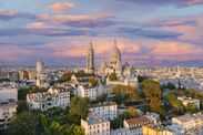 Aerial view of Montmartre hill with Basilique du Sacre-Coeur in Paris during sunset Paris France