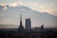 Torino landscape with the iconic Mole Antonelliana and the Intesa Sanpaolo skyscraper.
