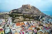 Aerial image of Santa Barbara Castle, historic fortress perched atop Mount Benacantil in Alicante, Spain.  Travel destinations and famous places concept