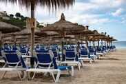 empty sunchairs on the beach of camp de mar on the island of Majorca