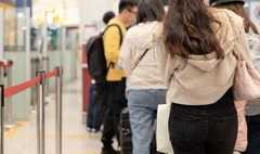 Passengers lined up at the airport 