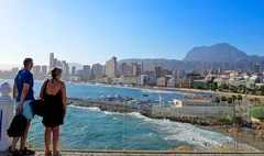 Tourists take in a view of the coast of Benidorm on September 10, 2025. In the face of protests in the Balearic Islands, the Can