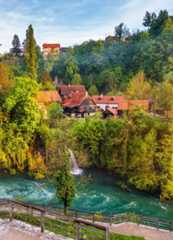 Village of Rastoke near Slunj in Croatia, old water mills on waterfalls of Korana river, beautiful countryside landscape. Landscape with river and lit