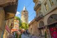 View of the 169 foot tall Galata Tower, or Galata Kulesi, a 14th century Genoese tower and former medieval prison in the Beyoğlu district of Istanbul, Turkey.