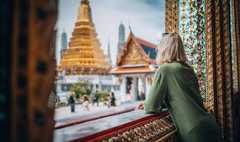 Young woman exploring Grand Palace and Wat Phra Kaew in Bangkok, Thailand