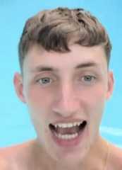 Man using smartphone by the poolside sitting
