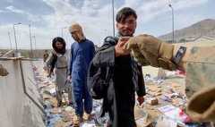 A scene depicts several individuals in an outdoor setting, possibly a rural or underdeveloped area, characterized by an accumula