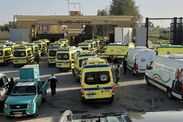 Ambulances and medical teams affiliated with the Egyptian Ministry of Health arrive at the Rafah Border Crossing on the Egypt-Gaza border, standing by