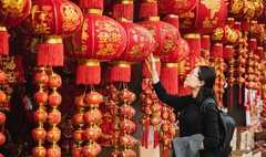 Don't wear 1 colour during Chinese New Year or risk bad luck in 2026 A woman shopping for Chinese New Year decorations
