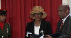SVG gov’t opts to install new GG on Emancipation Day Governor General Susan Dougan, centre, is administered the oaths of Office and Allegiance by High Court judge, Justice Brian Cottle, while Dougan’s ADC, Phillips Cambridge looks on. (iWN photo)