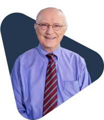 Educator kevin ahern wearing glasses and a striped tie.