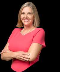 Kim posey triangle foreground min Kim posey, a woman with blonde hair in a pink dress.