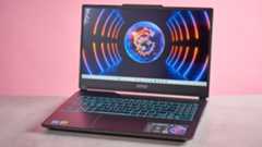 Three-quarter view of MSI Cyborg 15 A13U open on desk on a pink background