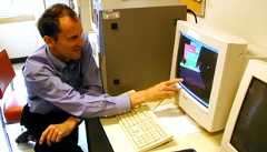 Images from the SETI@home project, including a screenshot of the SETI@home data and a man looking at a large computer with the same screen