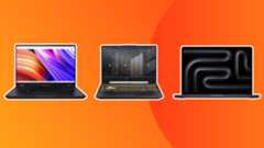 three laptops for game development on an orange background