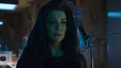 She-Hulk has a concerned expression on her face as she stands in Smart Hulk's lab in her Disney Plus show